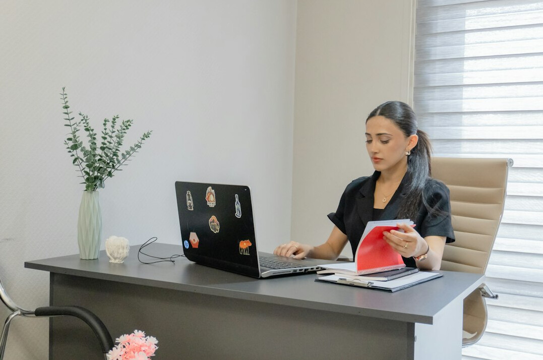 insurance policy documents with laptop